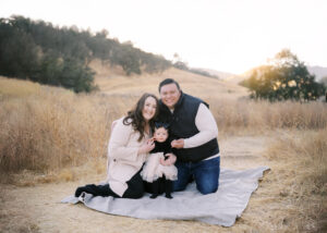 Family Photo with mom and dad holding daughter
