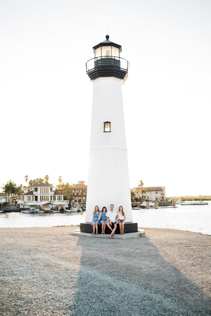 Family walking at Discovery Bay Marina boardwalk at sunset image by Vanessa Montano Photography.