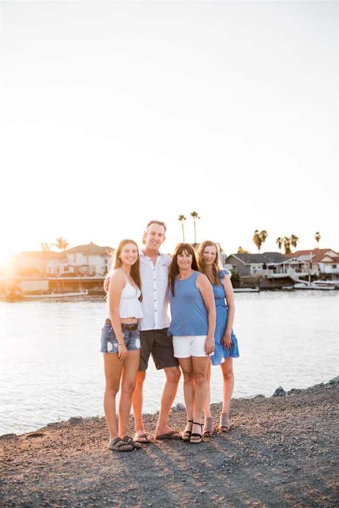 Family walking at Discovery Bay Marina boardwalk at sunset, image by Vanessa Montano Photography.