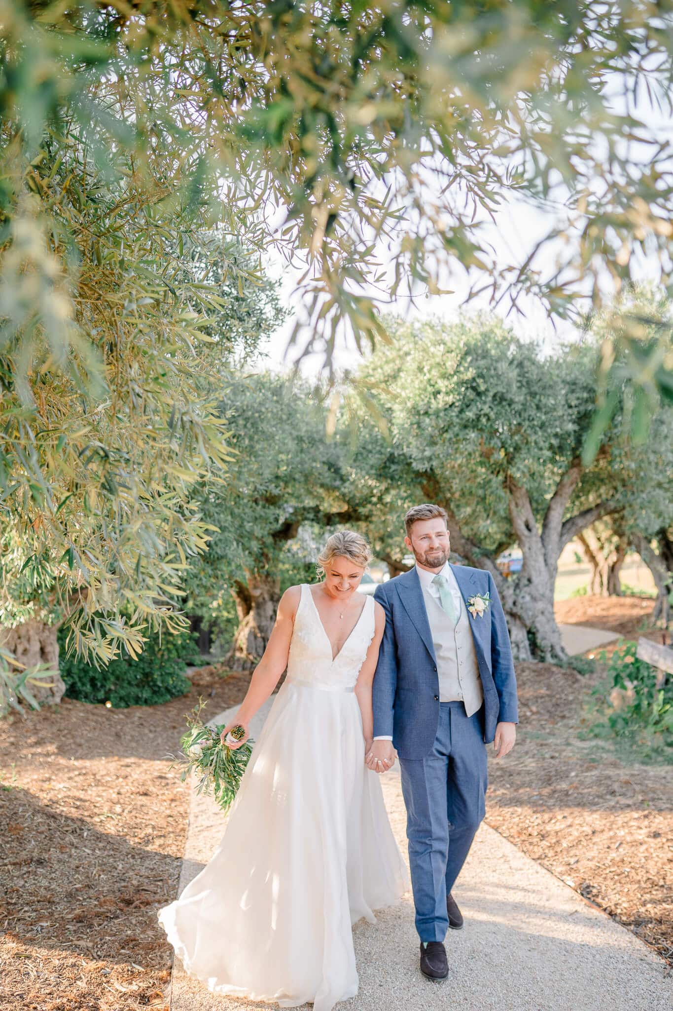 Couple walnut together smiling at Wente Vineyards a Livermore Wedding Venue by Vanessa Montano, Livermore Wedding Photographer