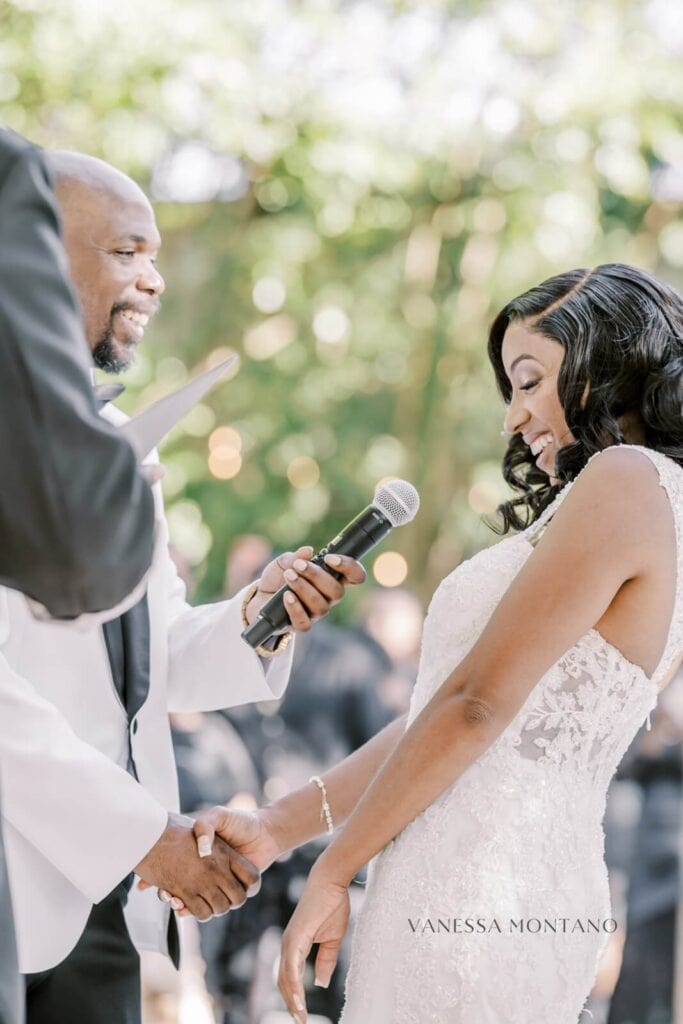 Bride smiling during ceremony vows by Vanessa Montano