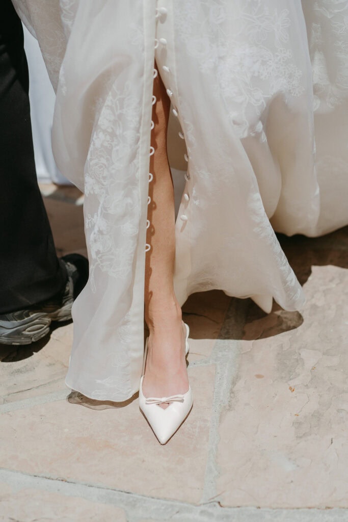 Bride's wedding shoes on steps at Livermore vineyard wedding photographed by Vanessa Montano