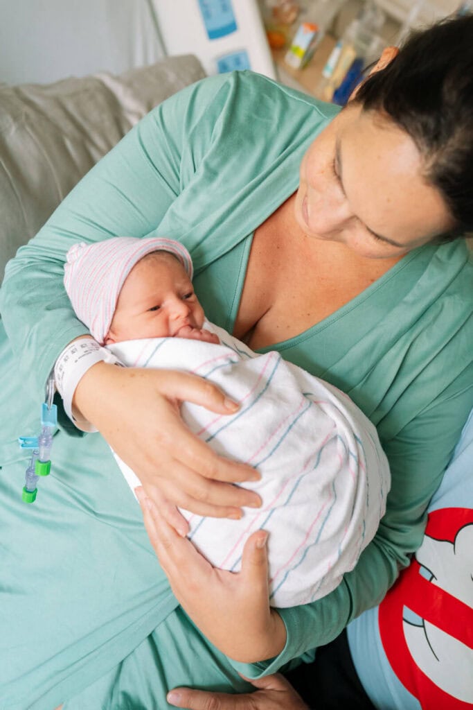 Mother and newborn sharing a quiet moment during a Bay Area hospital newborn photography session